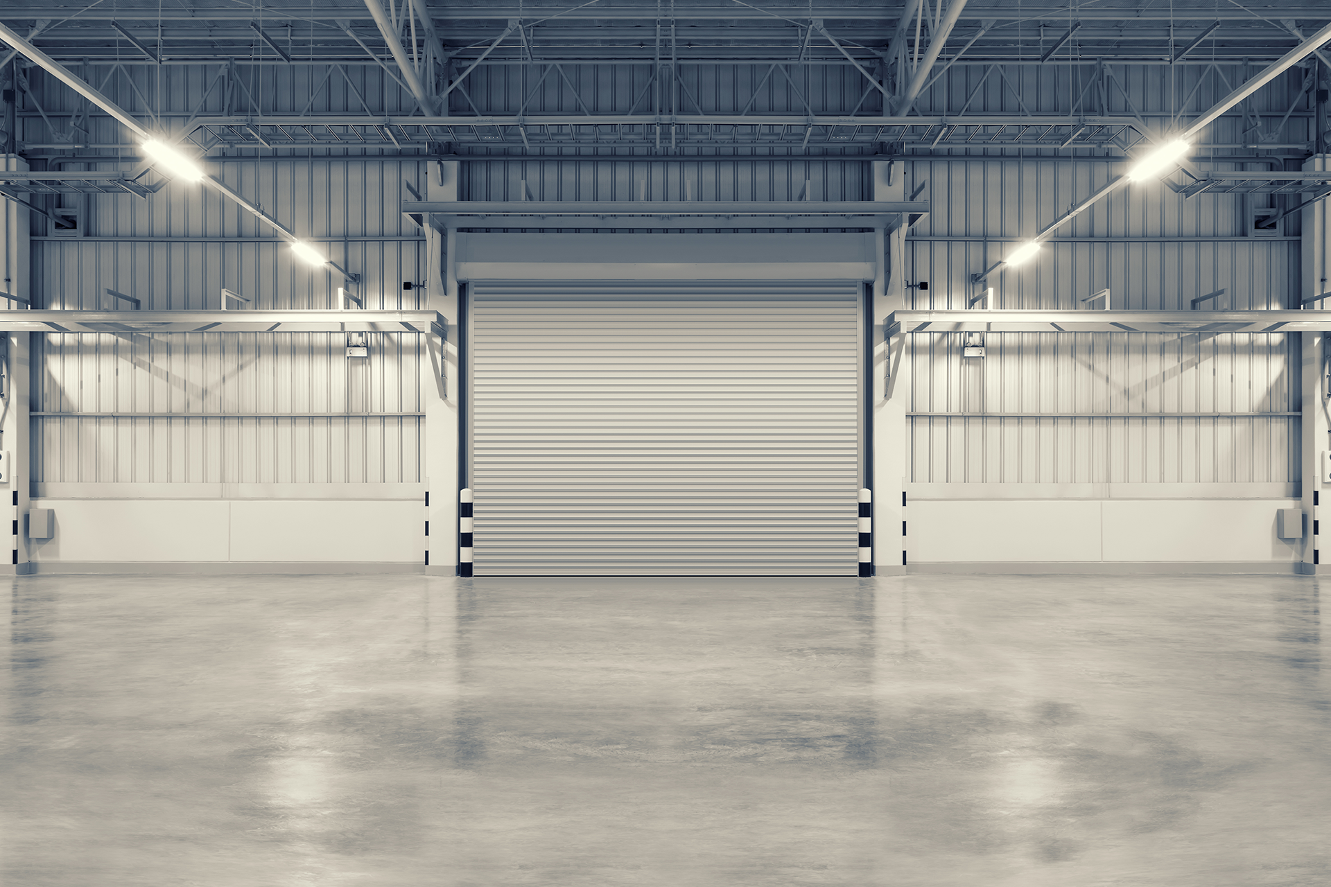 Wide view of newly installed commercial roll-up garage door in Pacoima, CA
