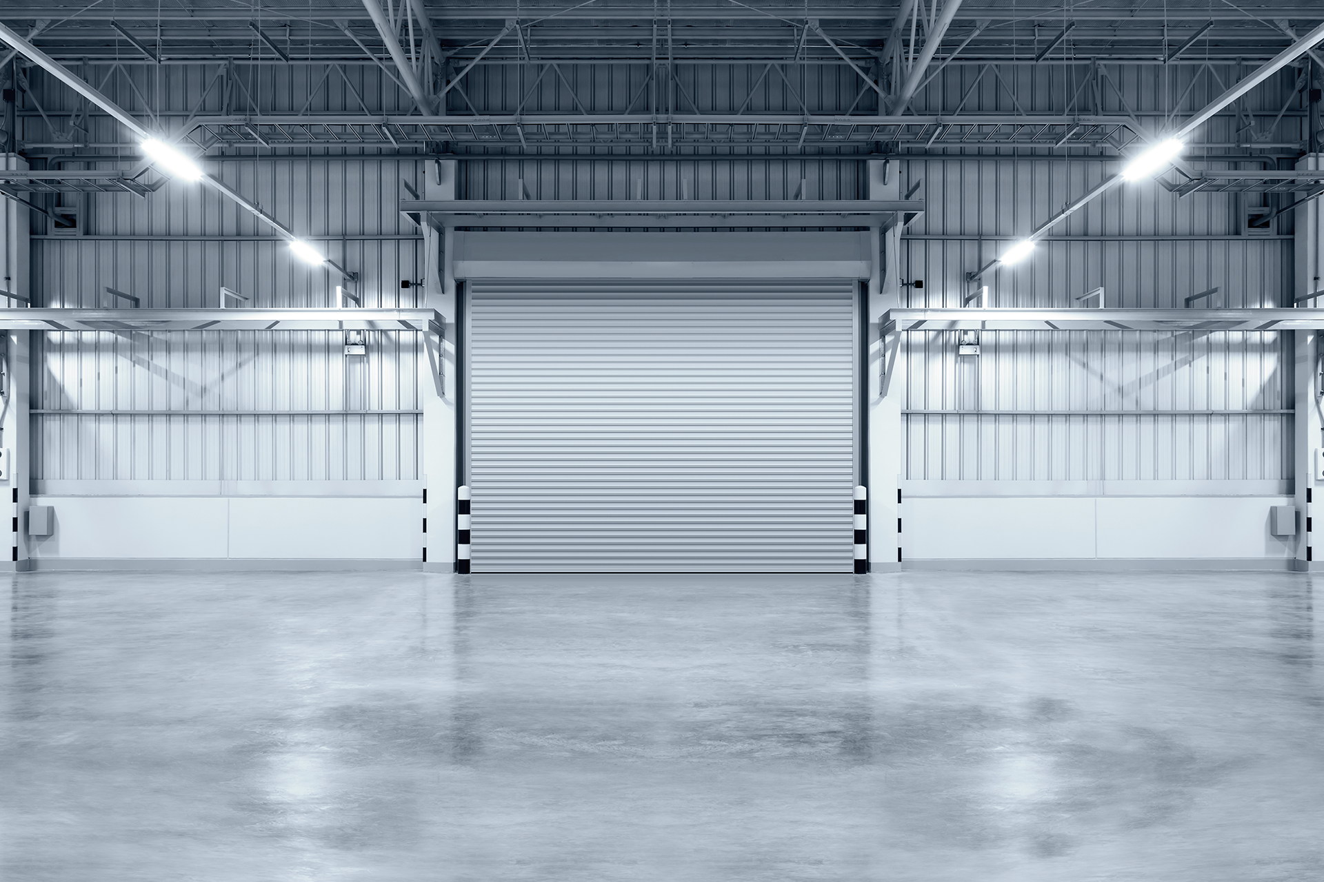 Detail of warehouse garage door frame and overhead support structure