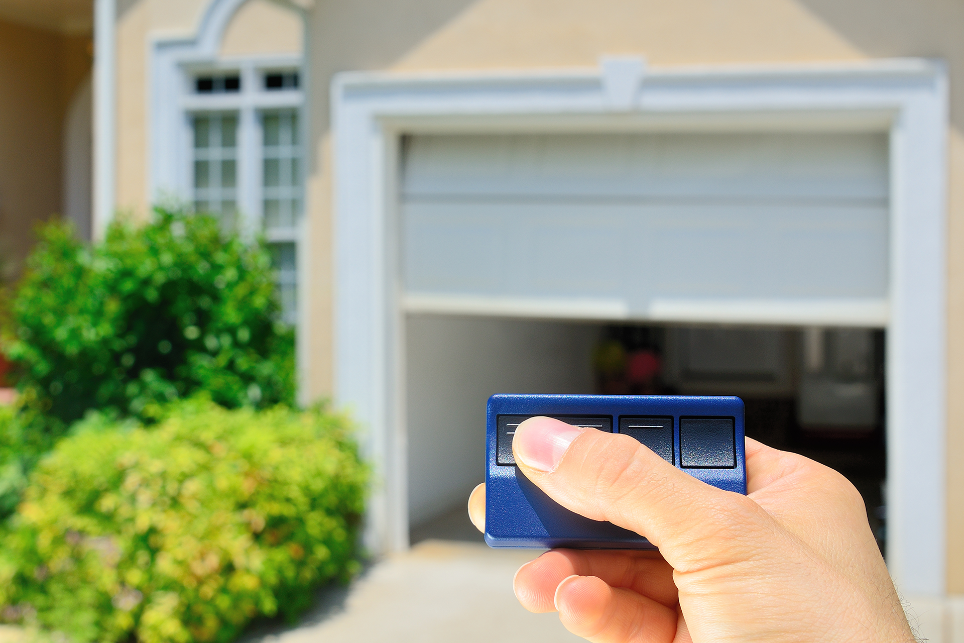 Technician installing garage door opener motor